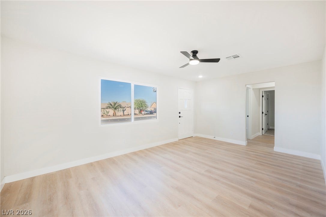 223 W Basic Road, Henderson, NV 89015 Clean lines and light-colored flooring define this versatile main living area.