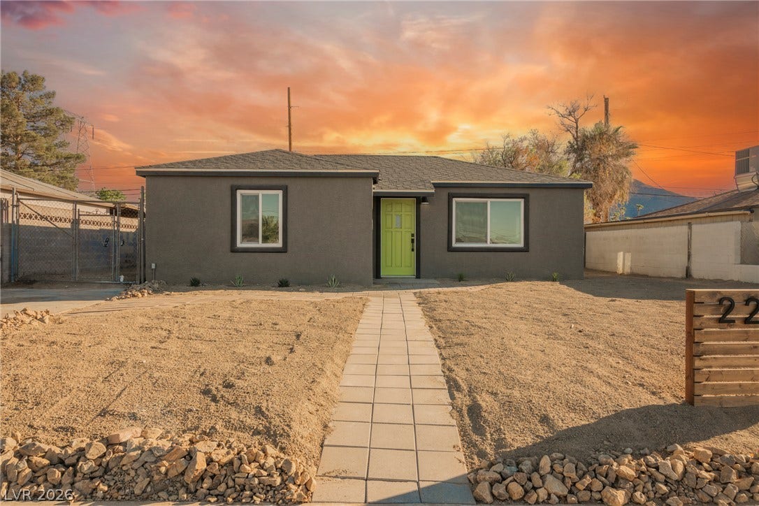 223 W Basic Road, Henderson, NV 89015 A paved path leads directly to the front entrance of this single-story stucco home.