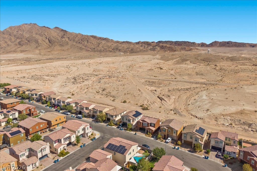Dramatic mountain vistas frame this peaceful residential neighborhood bordered by vast desert beauty.