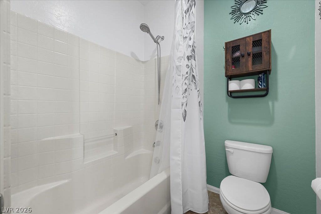 Tiled tub and shower surround anchors this functional bathroom space.