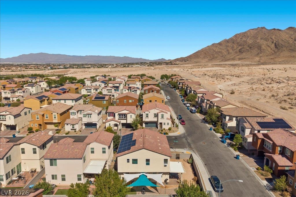 Dramatic mountain backdrops frame this peaceful desert neighborhood of modern multi-level homes.