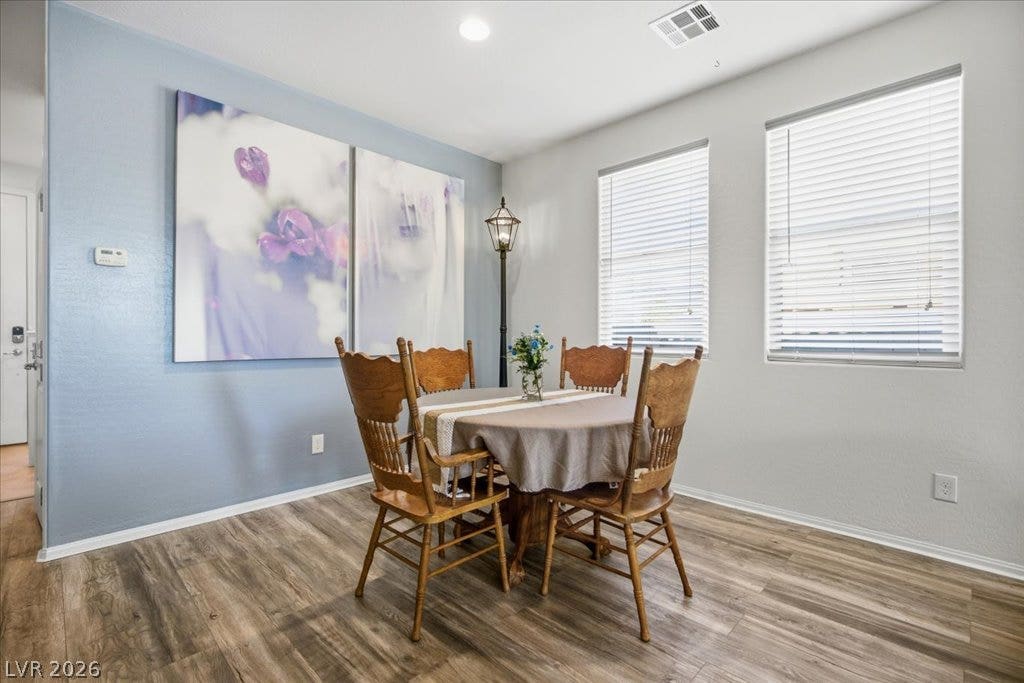 A cheerful dining area with natural light, neutral walls, and durable flooring.