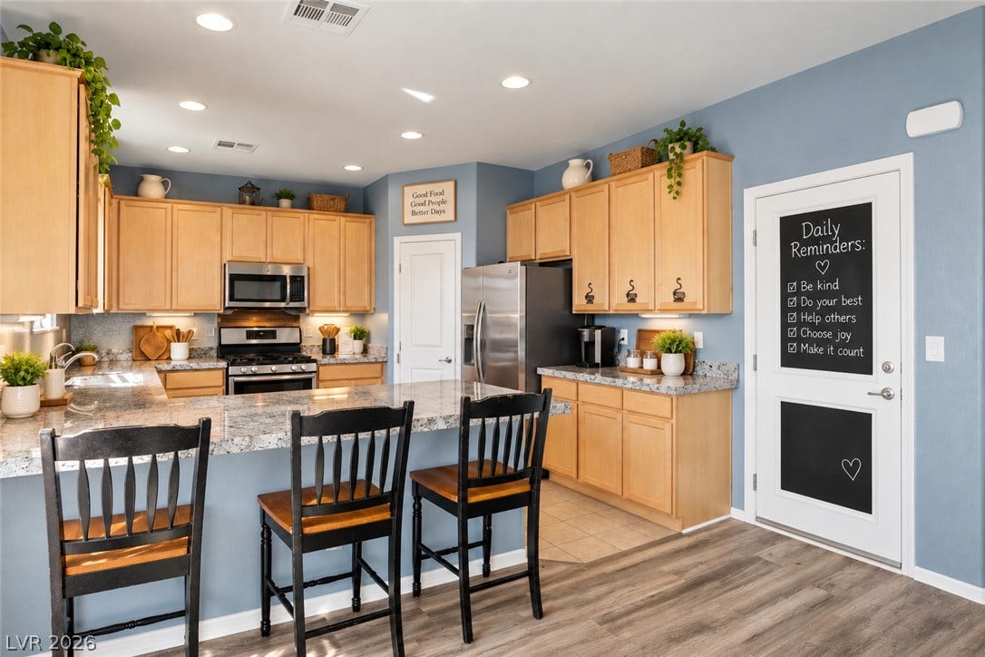 Polished 3" granite countertops with natural edge complement 42" wood cabinetry. Plenty of counter and cabinet space for your every need.