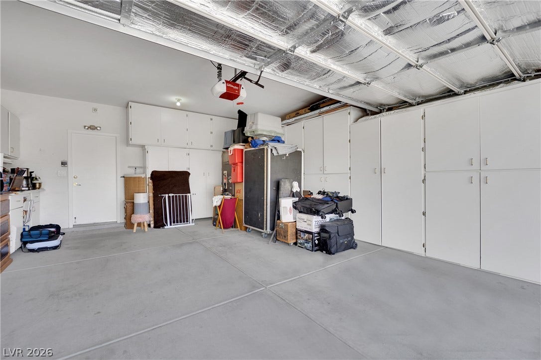 1811 Tiger Creek Avenue, Henderson, NV 89012 Air-conditioned two-car garage with Mitsubishi Electric ductless mini-split system, built-in storage cabinets, and overhead storage