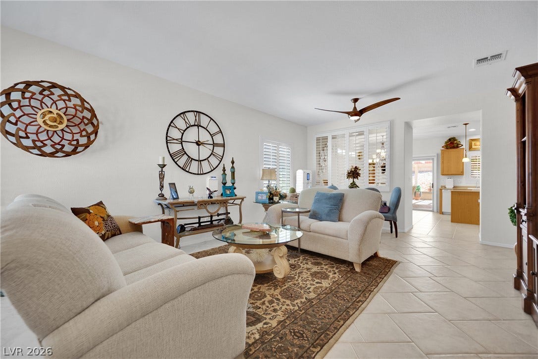 1811 Tiger Creek Avenue, Henderson, NV 89012 Light-filled great room with plantation shutters, and open flow to the kitchen and dining areas ideal for both everyday living and entertaining.