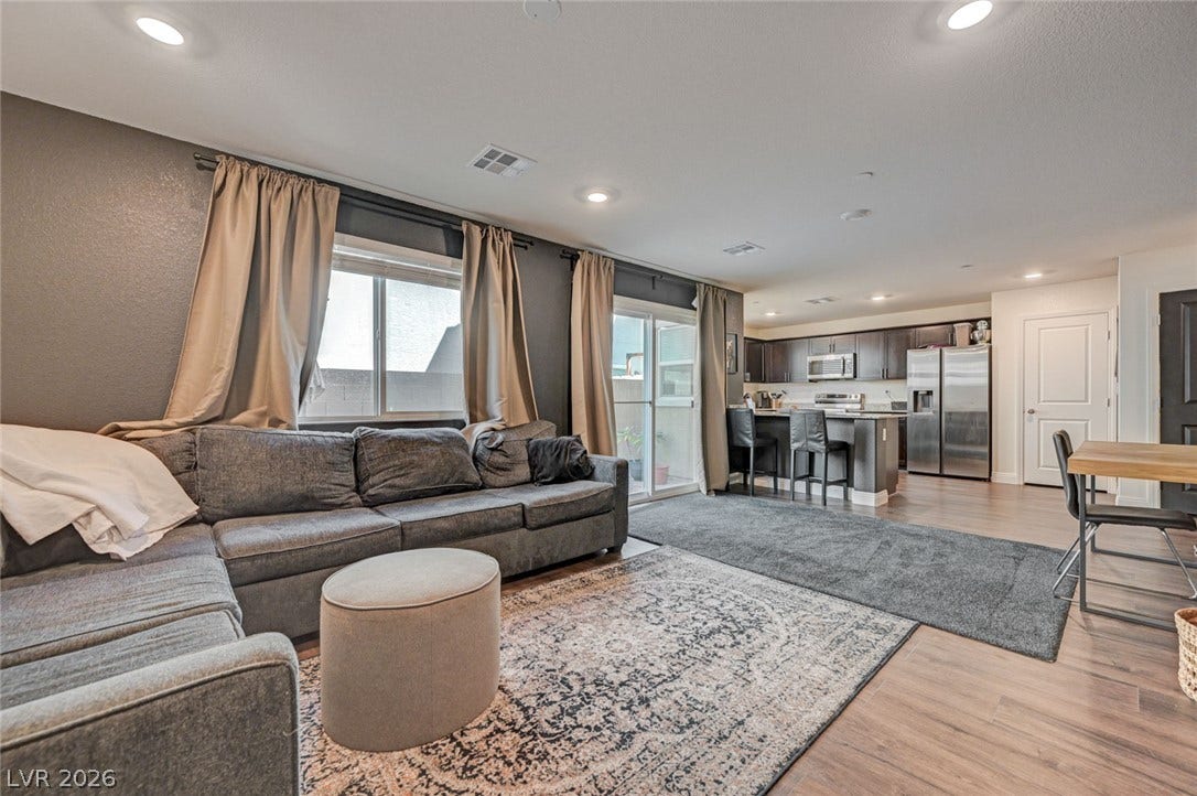 An open floor plan connects the comfortable living area directly to the kitchen.