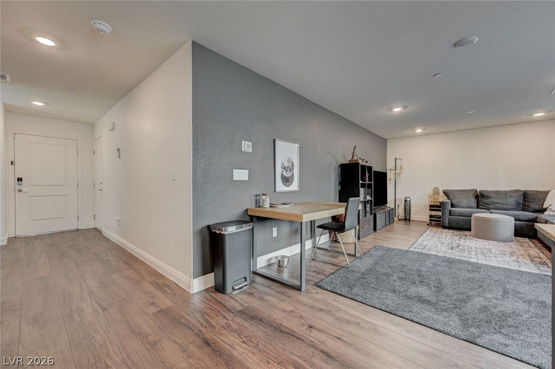 An open floorplan design seamlessly connects the welcoming entry hall with the main living area.