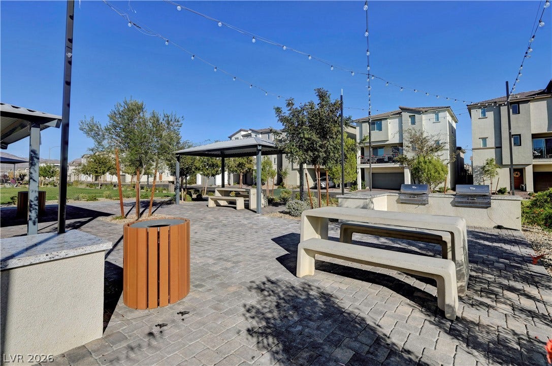 Paved patios under open skies set a welcoming scene for outdoor leisure.