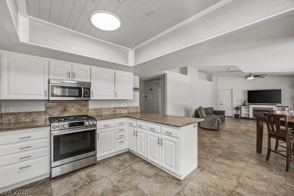 251 W Laval Drive, Henderson, NV 89015 Open sightlines from the kitchen into the dining and family rooms keep everyone connected, making this layout especially well suited for entertaining and everyday gatherings.