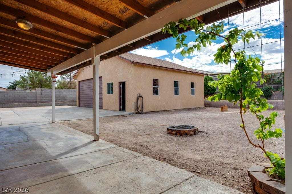 251 W Laval Drive, Henderson, NV 89015 The oversized backyard offers abundant open space, a fire pit area, mature landscaping, and plenty of room to personalize for your lifestyle.