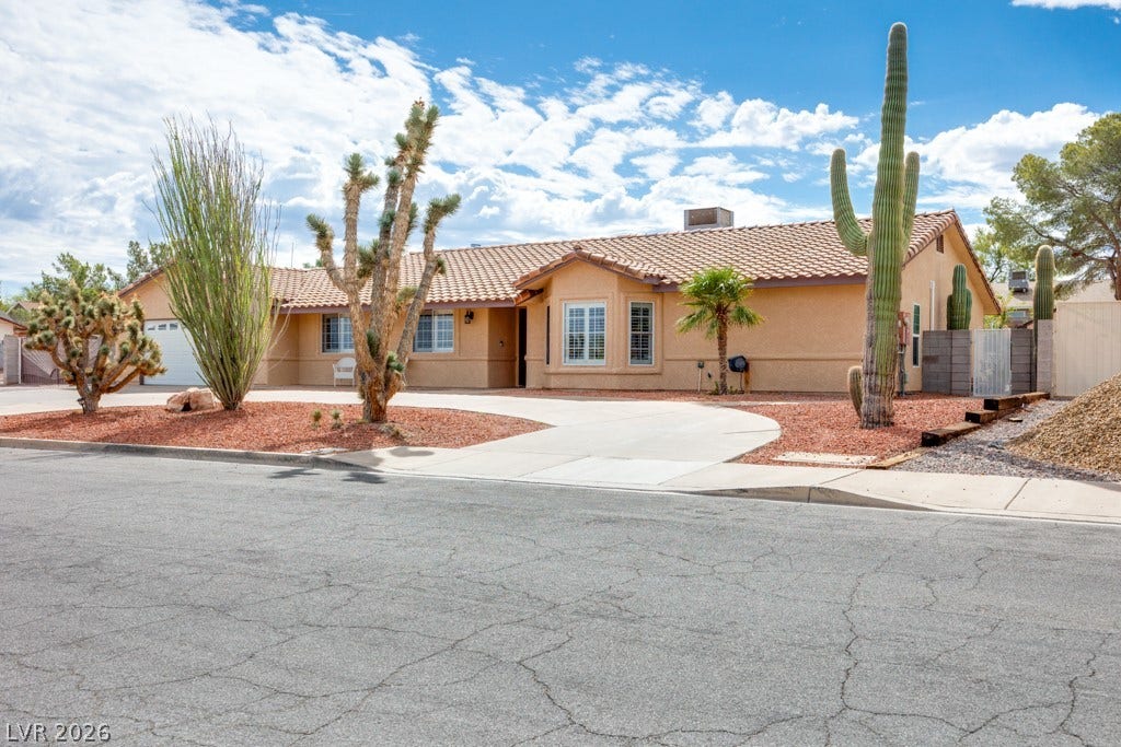 251 W Laval Drive, Henderson, NV 89015 Inviting single-story Henderson gem with classic Southwest architecture, no HOA, RV parking, mature desert landscaping, and an expansive horseshoe driveway offering plenty of off-street parking.