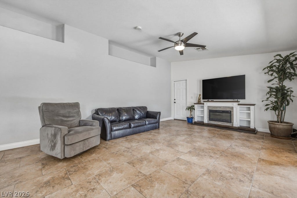 251 W Laval Drive, Henderson, NV 89015 Generous family room offers plenty of space to relax and gather.