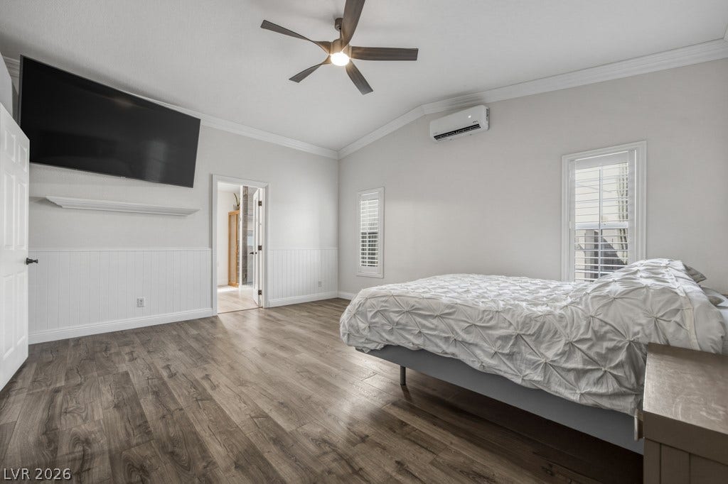 251 W Laval Drive, Henderson, NV 89015 The primary suite feels open and comfortable with multiple windows, plantation shutters, vaulted ceilings, wood-look flooring, and plenty of room for additional furniture.
