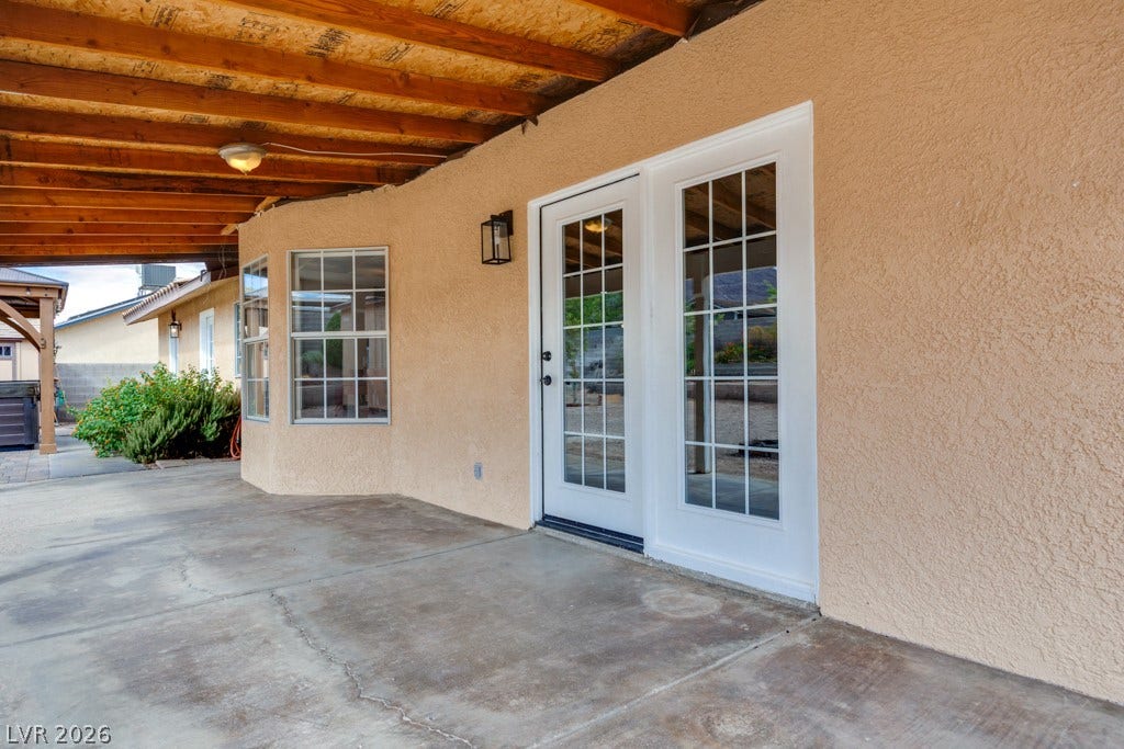 251 W Laval Drive, Henderson, NV 89015 An expansive covered patio runs along the home, with easy access through French doors.