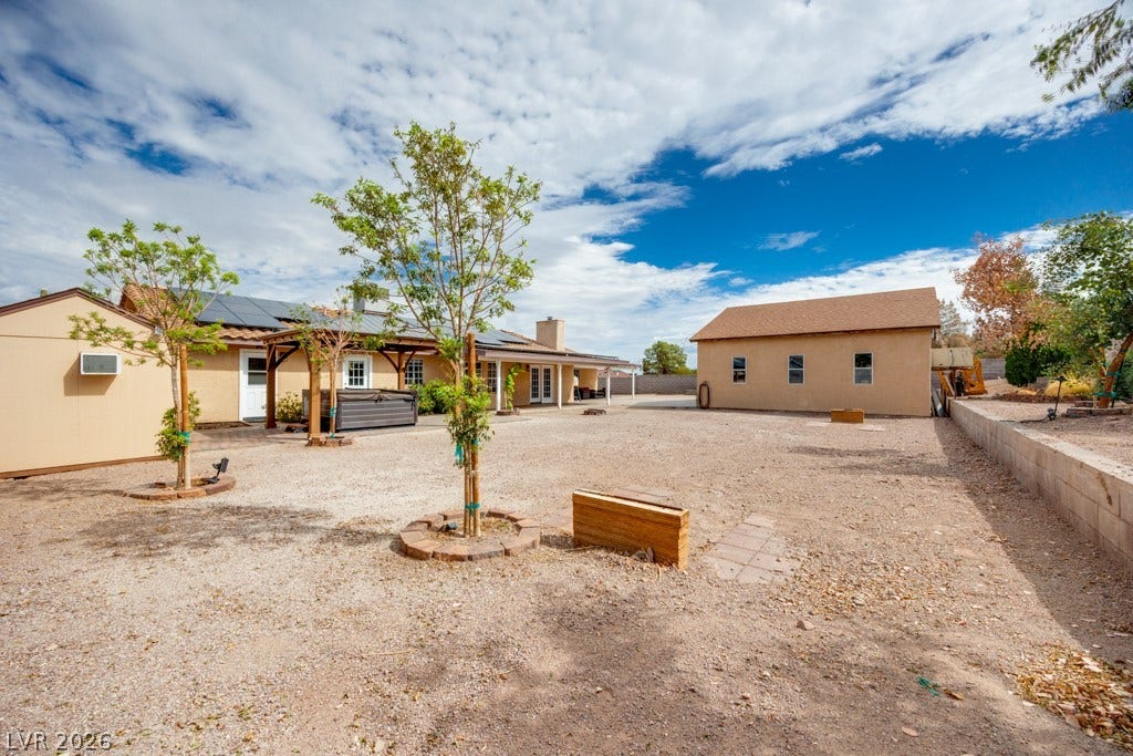 251 W Laval Drive, Henderson, NV 89015 The expansive backyard showcases just how much usable outdoor space this property offers, along with multiple covered areas and paid off solar panels on the home.