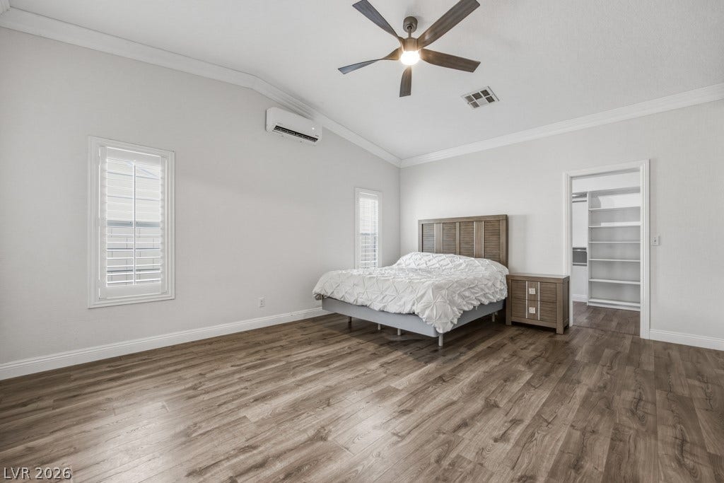 251 W Laval Drive, Henderson, NV 89015 The oversized primary suite, separate from other bedrooms, offers plenty of room to unwind, with wood-look flooring, vaulted ceilings, plantation shutters, a ceiling fan, and direct access to a large walk-in closet.