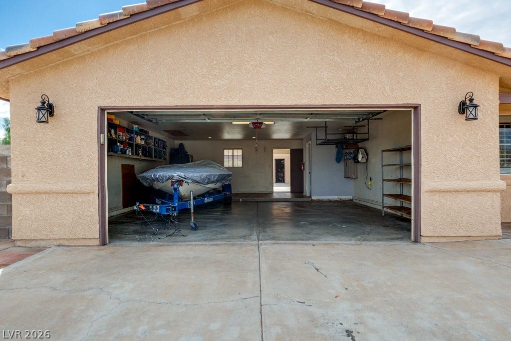 251 W Laval Drive, Henderson, NV 89015 Massive 29.5' x 25' garage delivers the ultimate combination of storage, workspace, and recreational flexibility. Featuring a full-size garage door, built-in storage, work areas, and expansive floor space, this is far more than a typical garage. The generous footprint easily accommodates vehicles, motorcycles, equipment, projects, and more. An exceptional setup for anyone who values space, functionality, and room to pursue their passions.