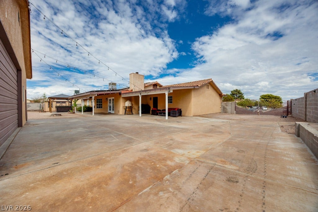 251 W Laval Drive, Henderson, NV 89015 The large backyard offers extensive RV parking alongside the detached garage/workshop-ideal for additional vehicles, recreational toys, or other storage needs.
