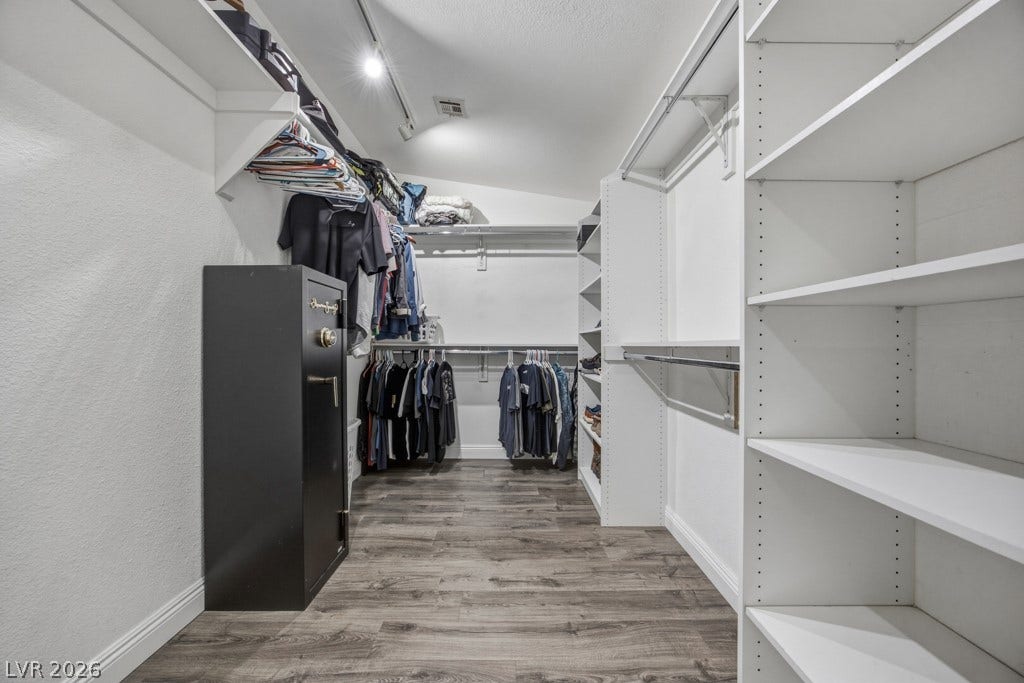 251 W Laval Drive, Henderson, NV 89015 Thoughtfully designed closet organization provides abundant shelving and hanging space, making excellent use of this oversized walk-in.