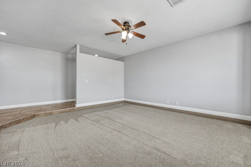 251 W Laval Drive, Henderson, NV 89015 Generously sized front living room with soft neutral finishes, abundant natural light, plantation shutters, and plenty of room to create a comfortable gathering space.