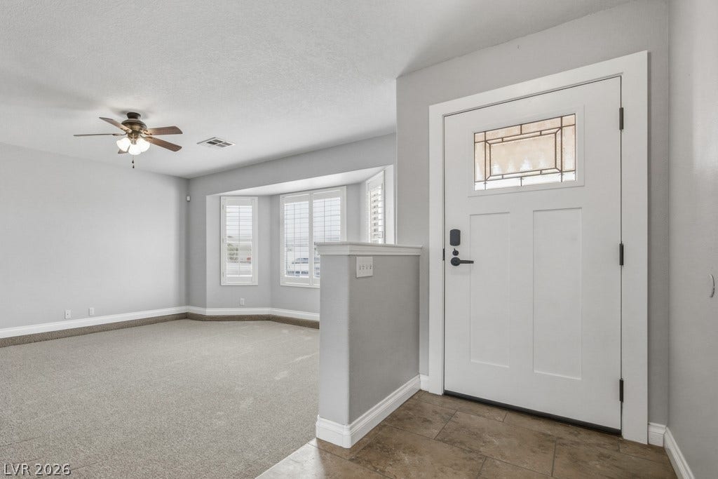 251 W Laval Drive, Henderson, NV 89015 Step inside to a bright, inviting entry that opens into a spacious living area. Beautiful bay windows with plantation shutters fill the room with natural sunlight. Neutral finishes and tile flooring at the entry create a clean, move-in-ready space.
