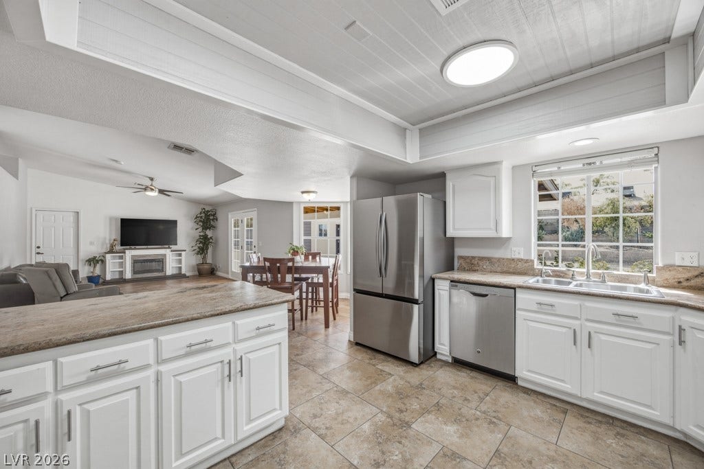 251 W Laval Drive, Henderson, NV 89015 Open sightlines from the kitchen into the dining and family rooms keep everyone connected, making this layout especially well suited for entertaining and everyday gatherings.