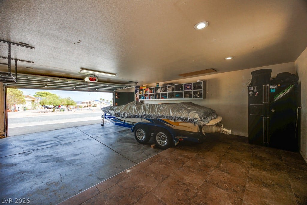 251 W Laval Drive, Henderson, NV 89015 Massive 29.5' x 25' garage delivers the ultimate combination of storage, workspace, and recreational flexibility. Featuring a full-size garage door, built-in storage, work areas, and expansive floor space, this is far more than a typical garage. The generous footprint easily accommodates vehicles, motorcycles, equipment, projects, and more. An exceptional setup for anyone who values space, functionality, and room to pursue their passions.