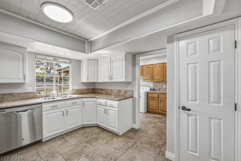 251 W Laval Drive, Henderson, NV 89015 A large garden window above the sink brings natural light into the kitchen, complemented by generous counter space, large pantry, abundant cabinetry, stainless steel appliances, and an open view into the main living areas.