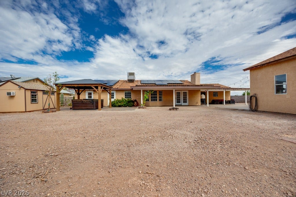 251 W Laval Drive, Henderson, NV 89015 The expansive backyard showcases just how much usable outdoor space this property offers, along with multiple covered areas and paid off solar panels on the home.