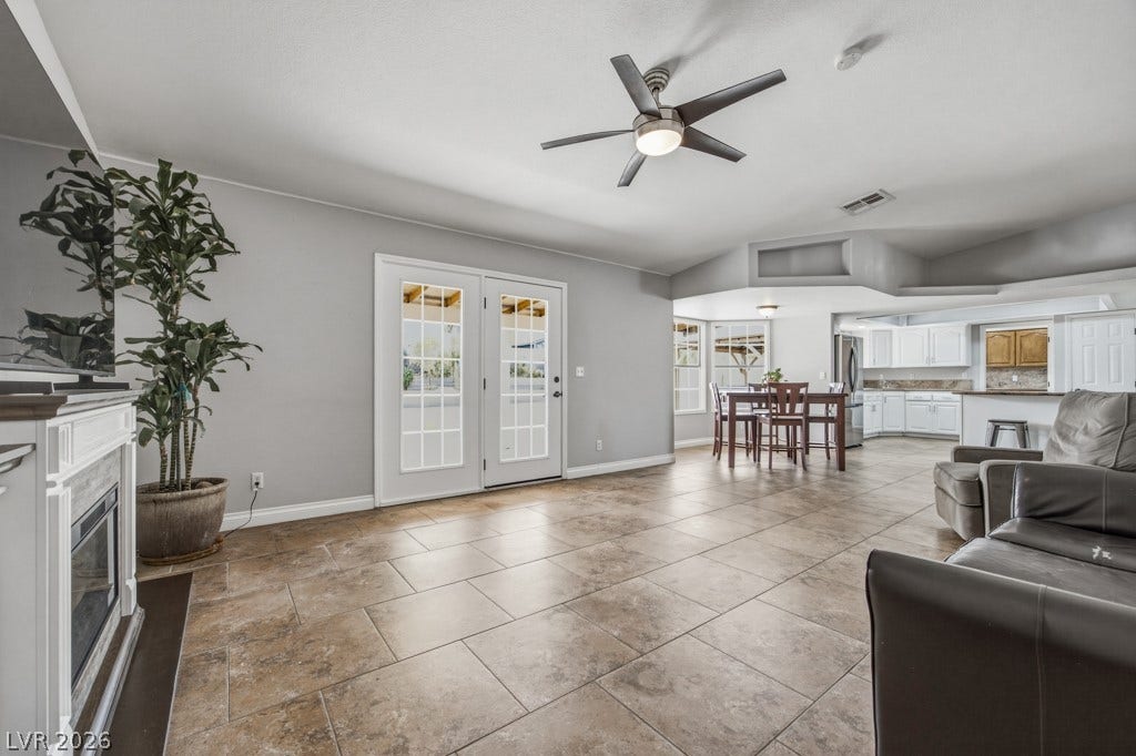 251 W Laval Drive, Henderson, NV 89015 The family room flows effortlessly into the dining area and kitchen, creating an open, connected layout that's ideal for entertaining and everyday life.