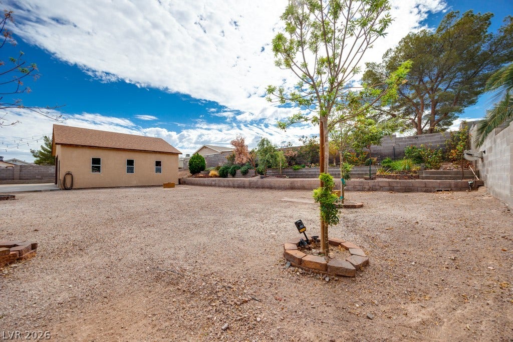 251 W Laval Drive, Henderson, NV 89015 The expansive backyard showcases just how much usable outdoor space this property offers, along with multiple covered areas and paid off solar panels on the home.
