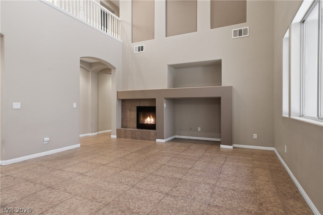 2 story living room with fireplace