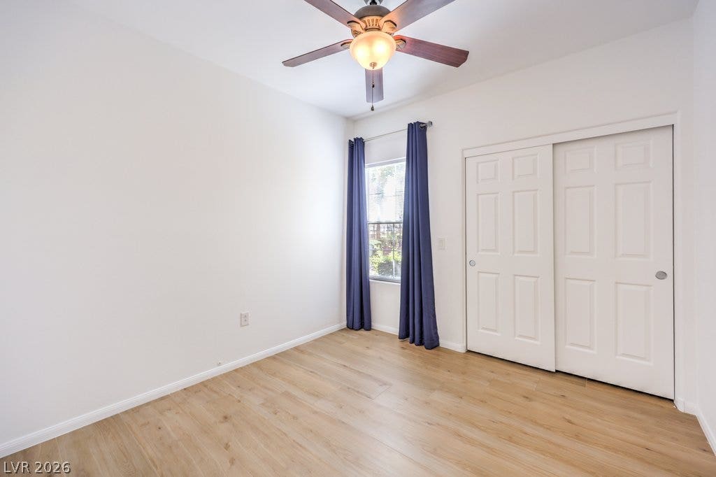 3910 Legend Hills Street, #103, Las Vegas, NV 89129 Smooth wood floors and tall windows define this versatile secondary room.