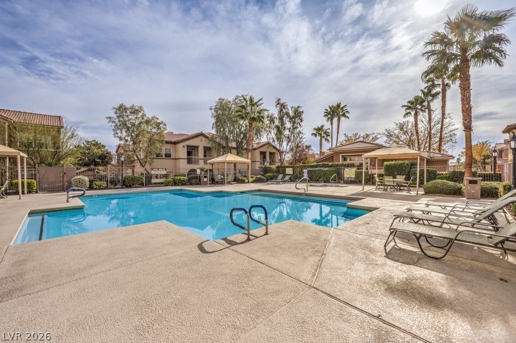 3910 Legend Hills Street, #103, Las Vegas, NV 89129 This is the main pool by the club house. Nice relaxing chairs.