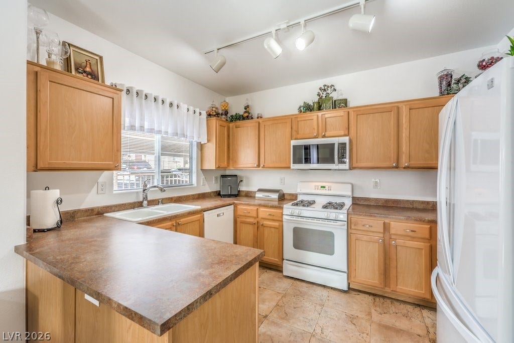 3910 Legend Hills Street, #103, Las Vegas, NV 89129 Very spacious kitchen with Maple Cabinets and stainless handles.