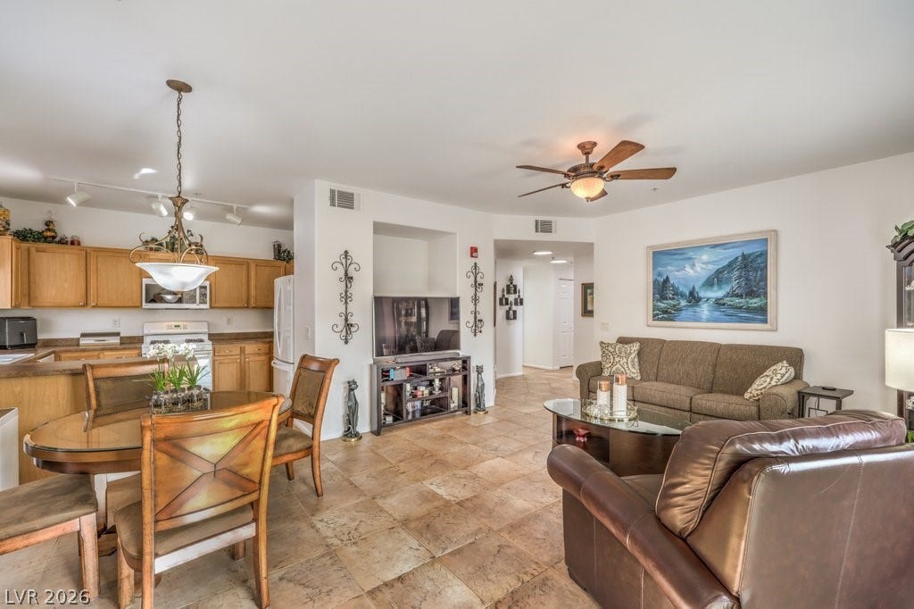 3910 Legend Hills Street, #103, Las Vegas, NV 89129 Spacious Great room with TILE flooring throughout. The seller has recently painted. It is a Two-toned White. Newer ceiling fan and light.