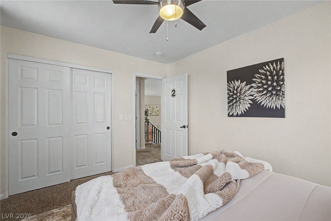 6025 Glenborough Street, North Las Vegas, NV 89115 Plush carpeting underfoot complements the clean architectural lines of this well-designed secondary bedroom.