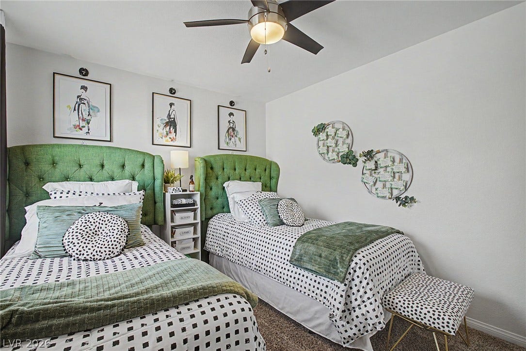 6025 Glenborough Street, North Las Vegas, NV 89115 A well-proportioned secondary bedroom includes plush carpeting and clean plaster walls.