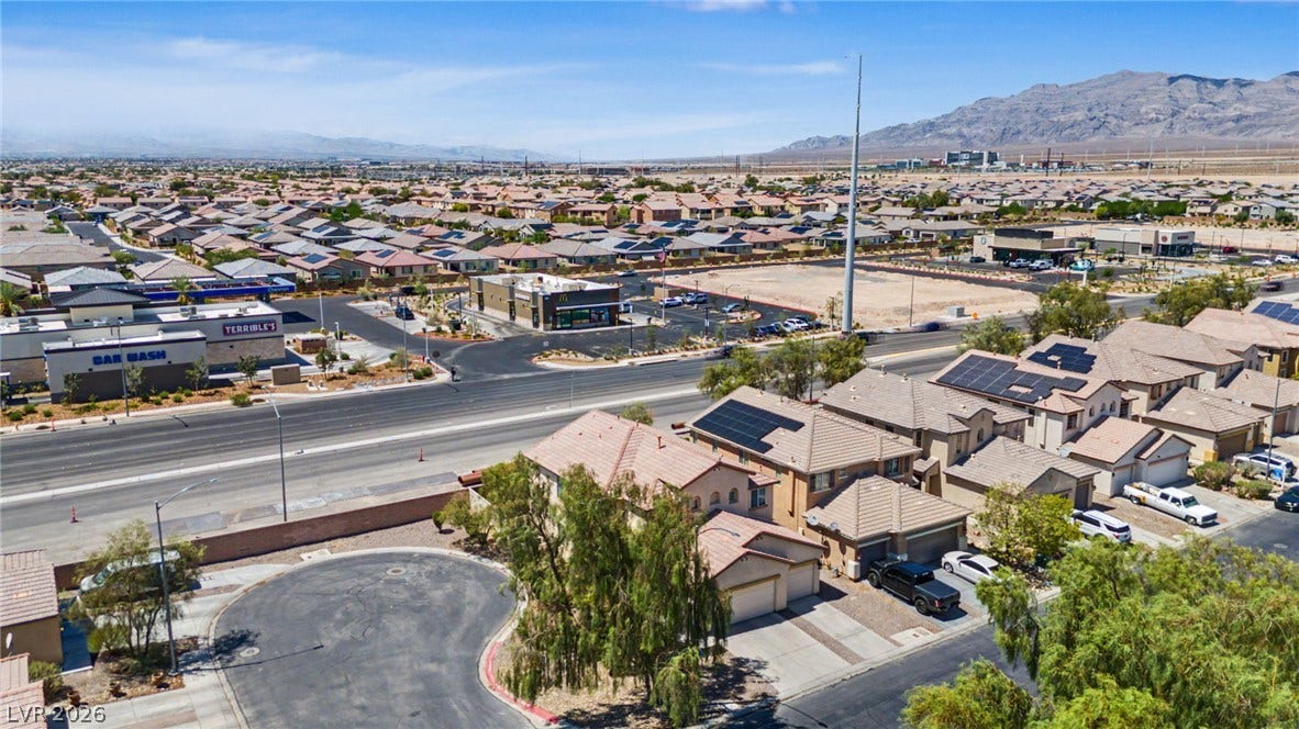 6025 Glenborough Street, North Las Vegas, NV 89115 Sweeping mountain vistas frame this peaceful neighborhood of modern multi-level homes.