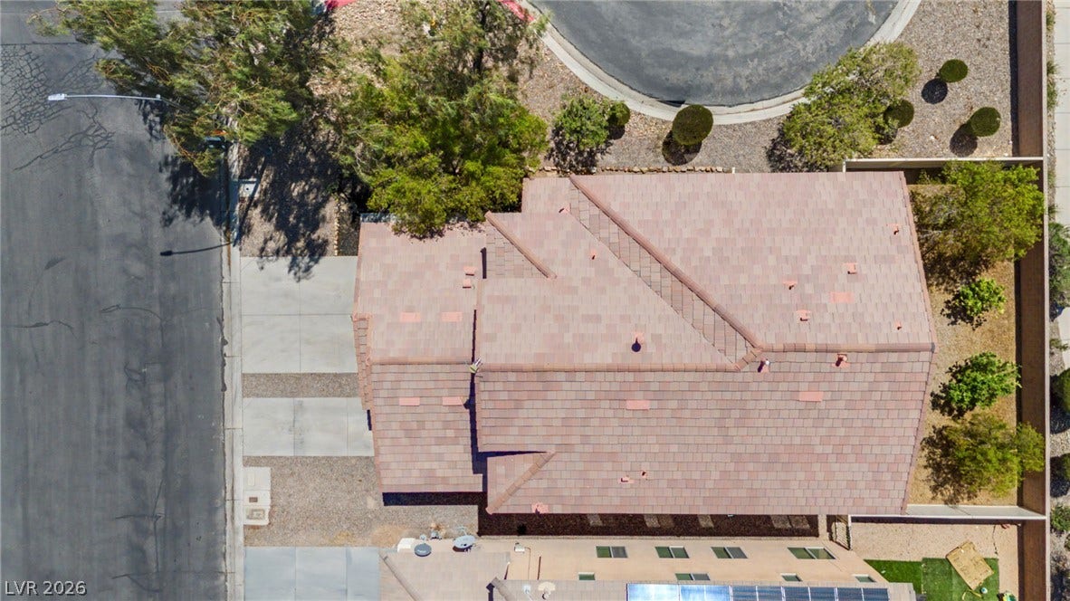 6025 Glenborough Street, North Las Vegas, NV 89115 An aerial perspective showcases the sturdy tile roof and clean surrounding property lines.
