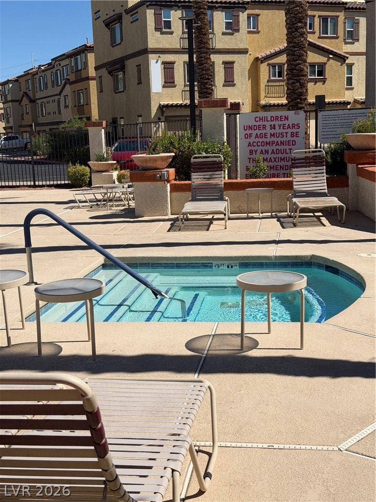 A sparkling community spa awaits just steps from the surrounding residential buildings.