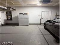 Smooth concrete floors and overhead storage define this clean, functional garage space.