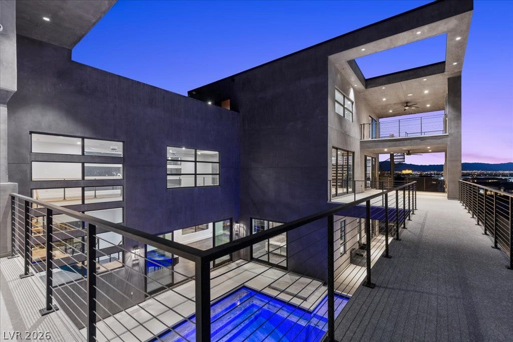 2839 Edgemont Drive, Henderson, NV 89074 Architectural splendor unfolds with a captivating pool and expansive balconies offering city views.