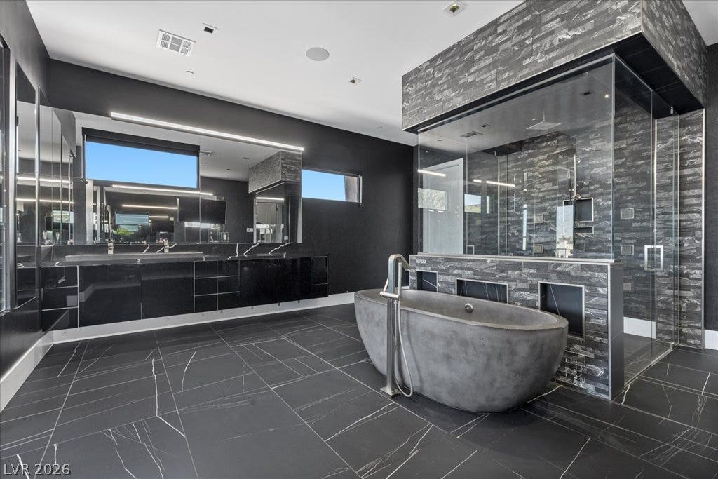 2839 Edgemont Drive, Henderson, NV 89074 Luxurious spa-like retreat with dual vanities, soaking tub, and a spacious glass-enclosed shower.