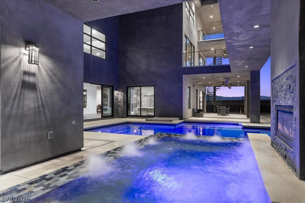 2839 Edgemont Drive, Henderson, NV 89074 A dazzling outdoor oasis featuring a sparkling blue pool and inviting outdoor living spaces.