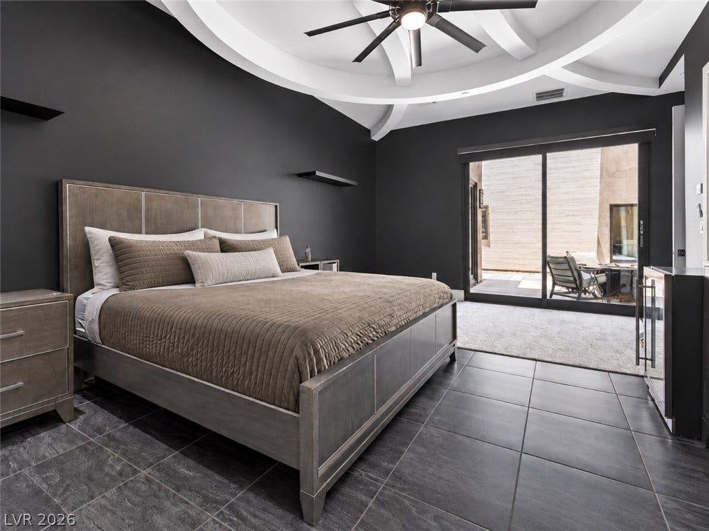2839 Edgemont Drive, Henderson, NV 89074 Dramatic dark walls contrast beautifully with the architectural details of a white beamed tray ceiling.