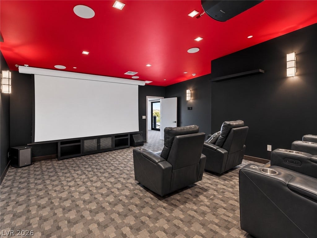 2839 Edgemont Drive, Henderson, NV 89074 Dramatic dark walls contrast with a bold ceiling in this custom private home theater.