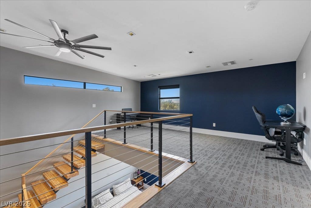 2839 Edgemont Drive, Henderson, NV 89074 A striking contemporary loft offers unique windows, an open staircase, and durable carpeting.