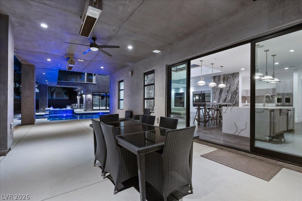 2839 Edgemont Drive, Henderson, NV 89074 An inviting outdoor patio features an entertainment space with an adjacent pool and kitchen access.