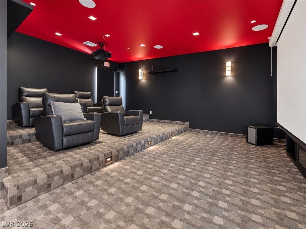 2839 Edgemont Drive, Henderson, NV 89074 Tiered carpeted flooring and a built-in projection screen create an authentic private cinema experience.